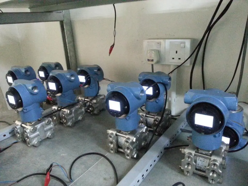 Blue pressure transmitters on a rack