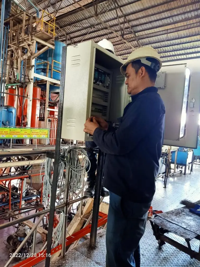Technician at a sterilizer station control panel