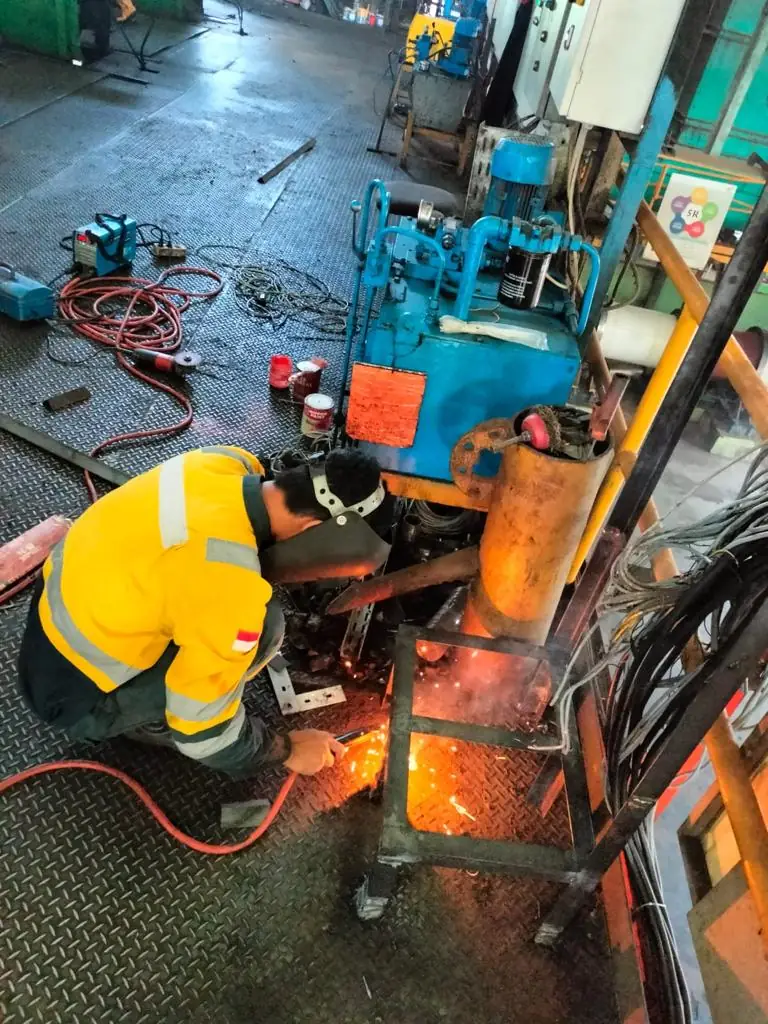 Technician welding on site